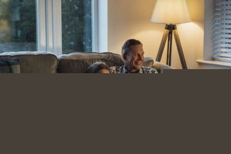Couple sitting comfortably on a sofa