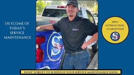 A satisfied technician is shown next to a truck with the company logo, implying a job well done
